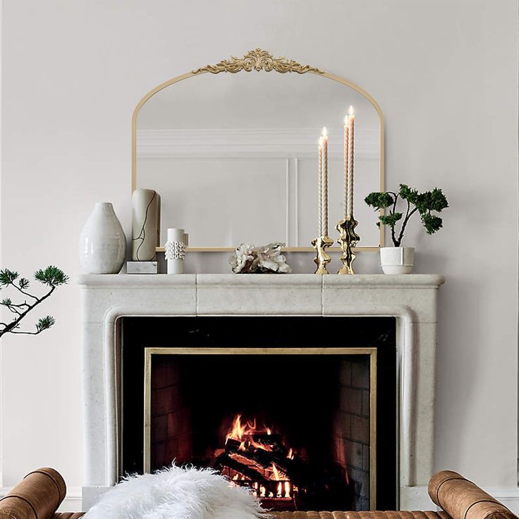 antique mirror above a fireplace creates a striking focal point that enhances both light and dimension within a room
